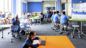 students sitting in school learning spaces